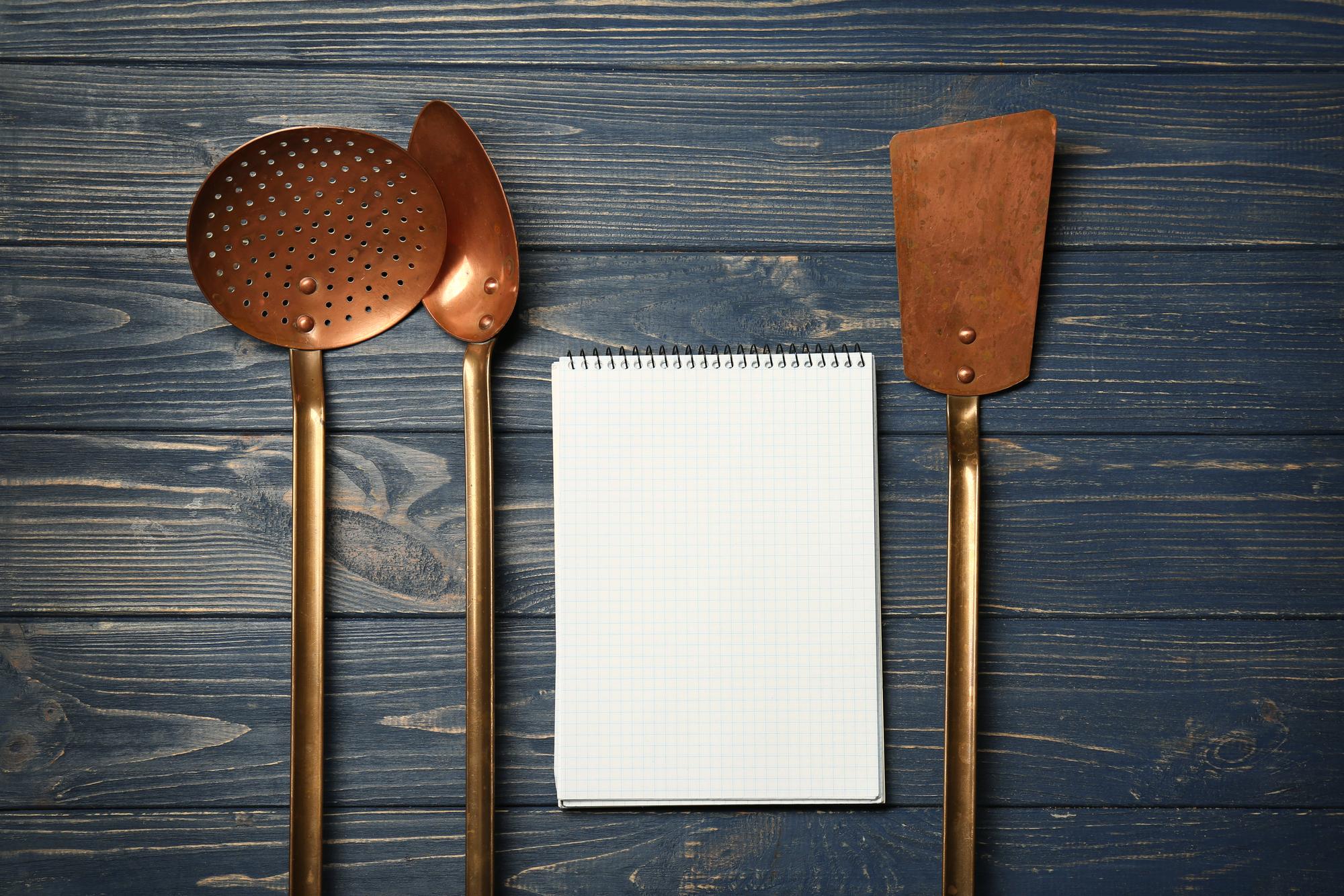 pricing visual with menu cards and kitchen tools